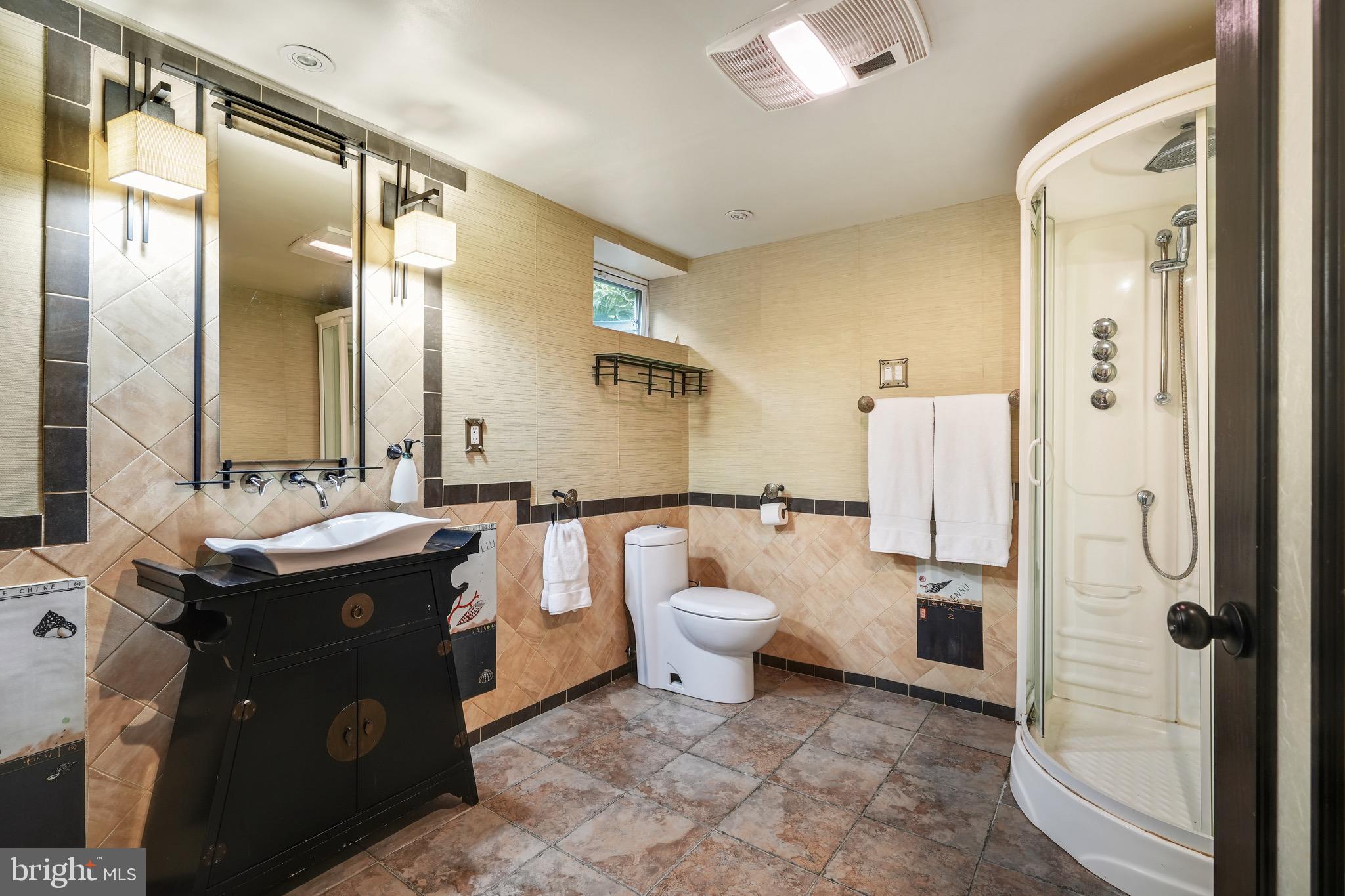 202 Burd Street Pennington, NJ 08534 - Photo 25 of 30 a bathroom with a granite countertop sink toilet and shower