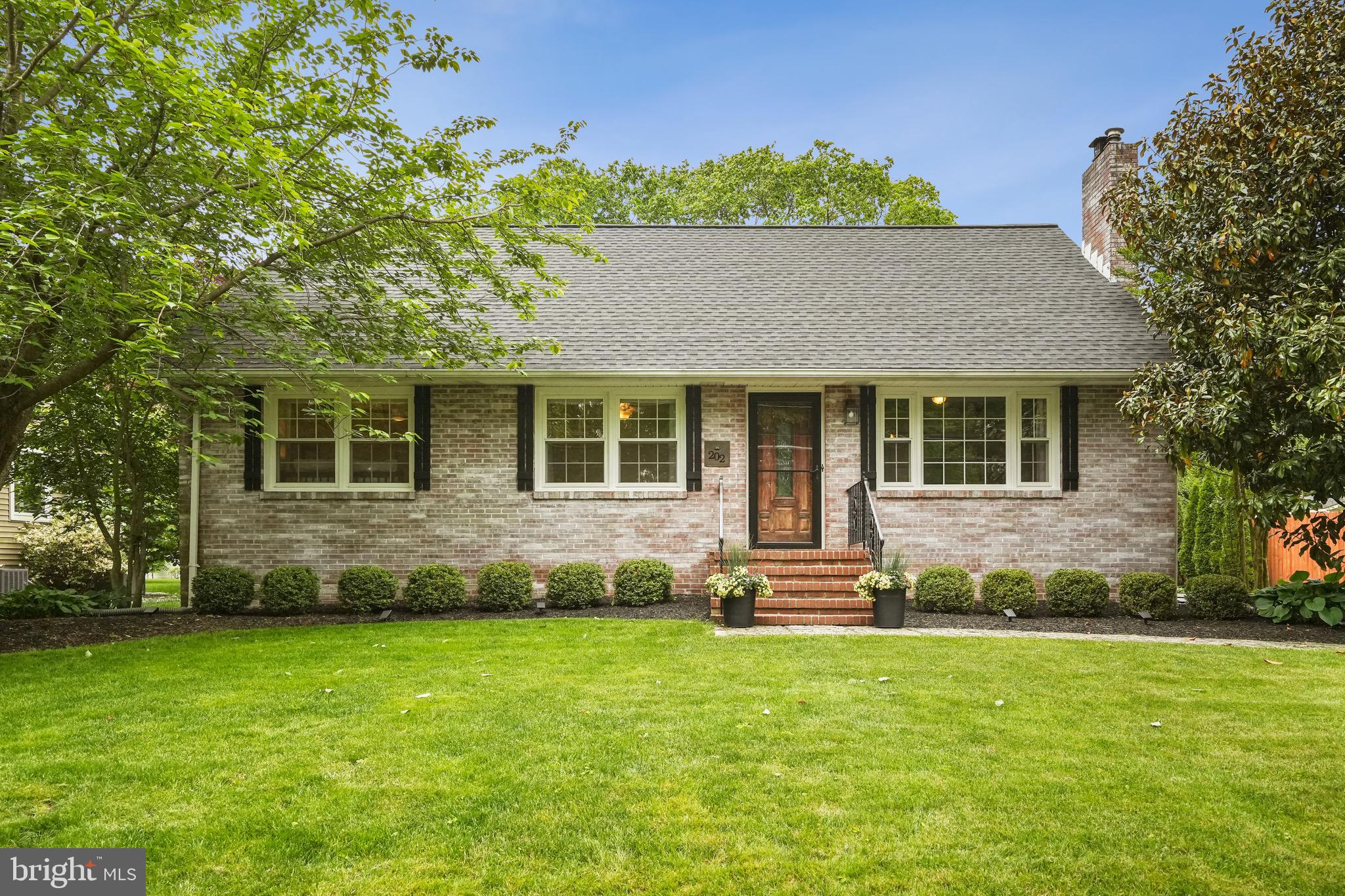 202 Burd Street Pennington, NJ 08534 - Photo 3 of 30 a front view of a house with a garden