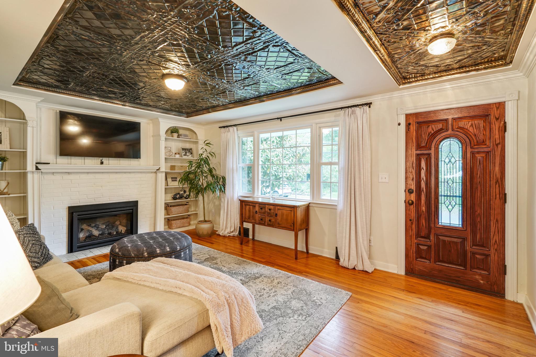 202 Burd Street Pennington, NJ 08534 - Photo 6 of 30 a bedroom with a bed and a flat screen tv