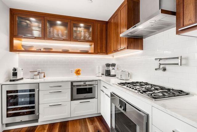 a kitchen with cabinets and appliances