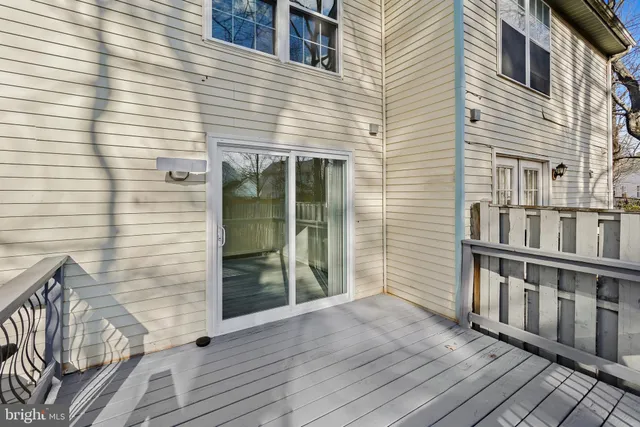 a view of a house with wooden deck