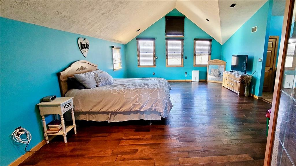 1535 Martin Road Tarentum, PA 15084 - Photo 14 of 25 a bedroom with a bed and wooden floor
