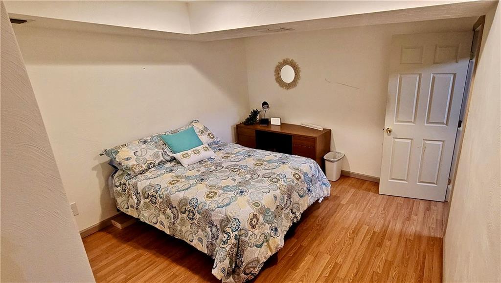 1535 Martin Road Tarentum, PA 15084 - Photo 20 of 25 a bedroom with a bed and wooden floor
