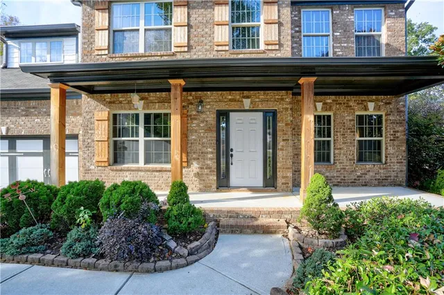 a front view of a house having yard