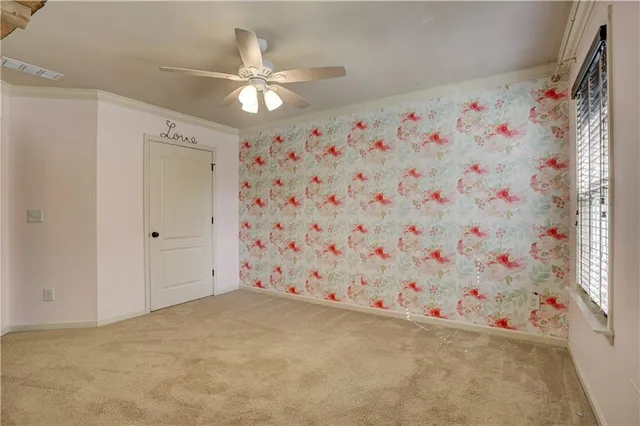 a view of a livingroom with closet and kitchen view