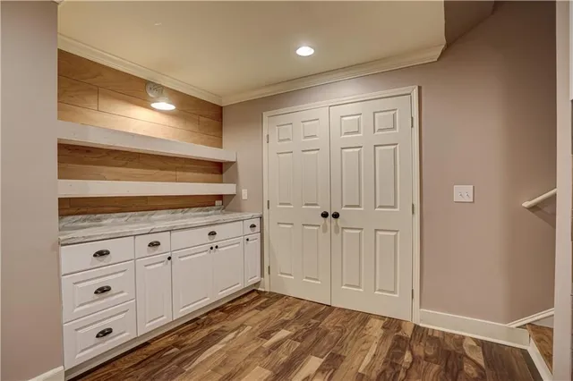 a bedroom with a bed and a ceiling fan
