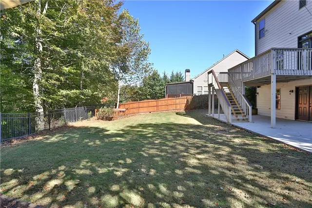 a view of a backyard with a trampoline
