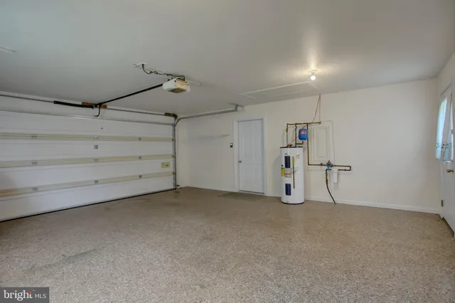 a view of a house with a yard and garage