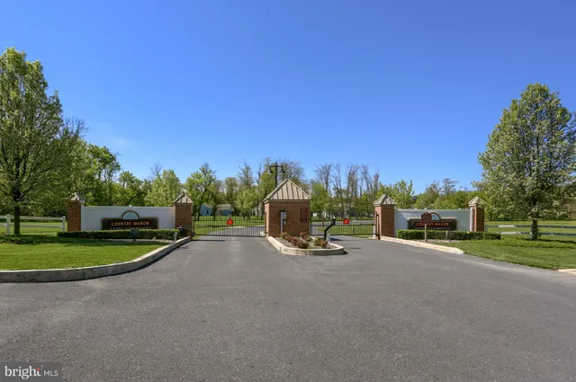 a front view of a house with a yard and outdoor seating