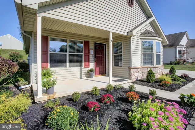 front view of a house with a yard