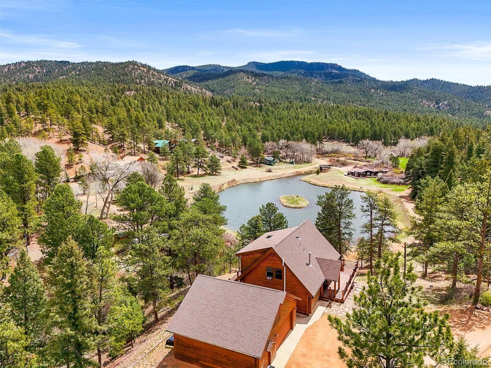 9868 South Overlook Road Sedalia, CO 80135 - Photo 14 of 50 a view of a lake with a mountain