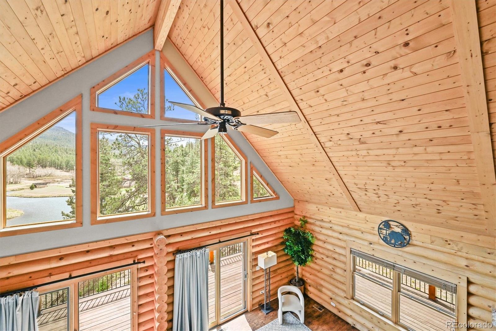 9868 South Overlook Road Sedalia, CO 80135 - Photo 20 of 50 a view of a balcony with furniture and iron stairs
