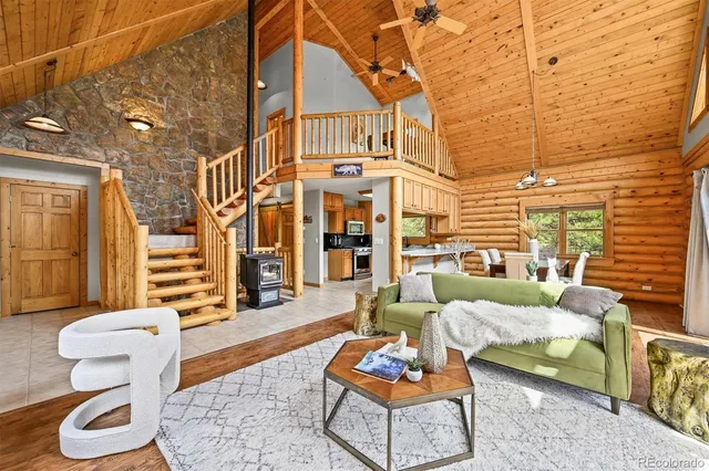 a view of a patio with a table and chairs and wooden floor