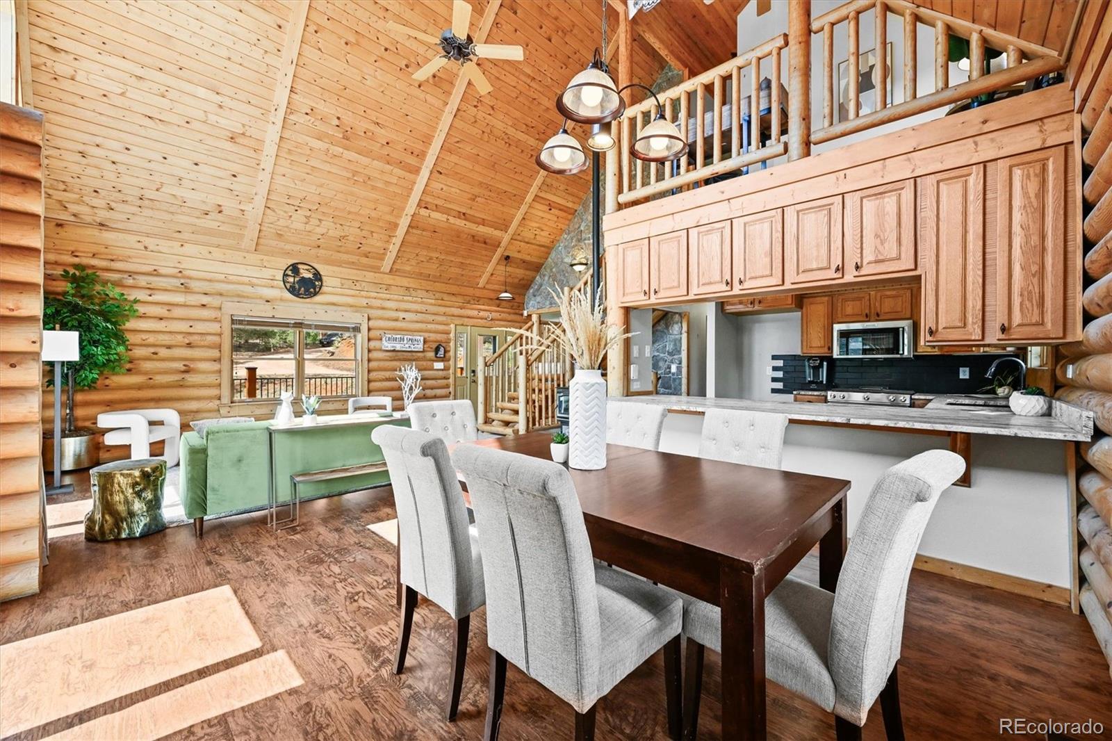 9868 South Overlook Road Sedalia, CO 80135 - Photo 24 of 50 a view of a dining table and chairs in the patio