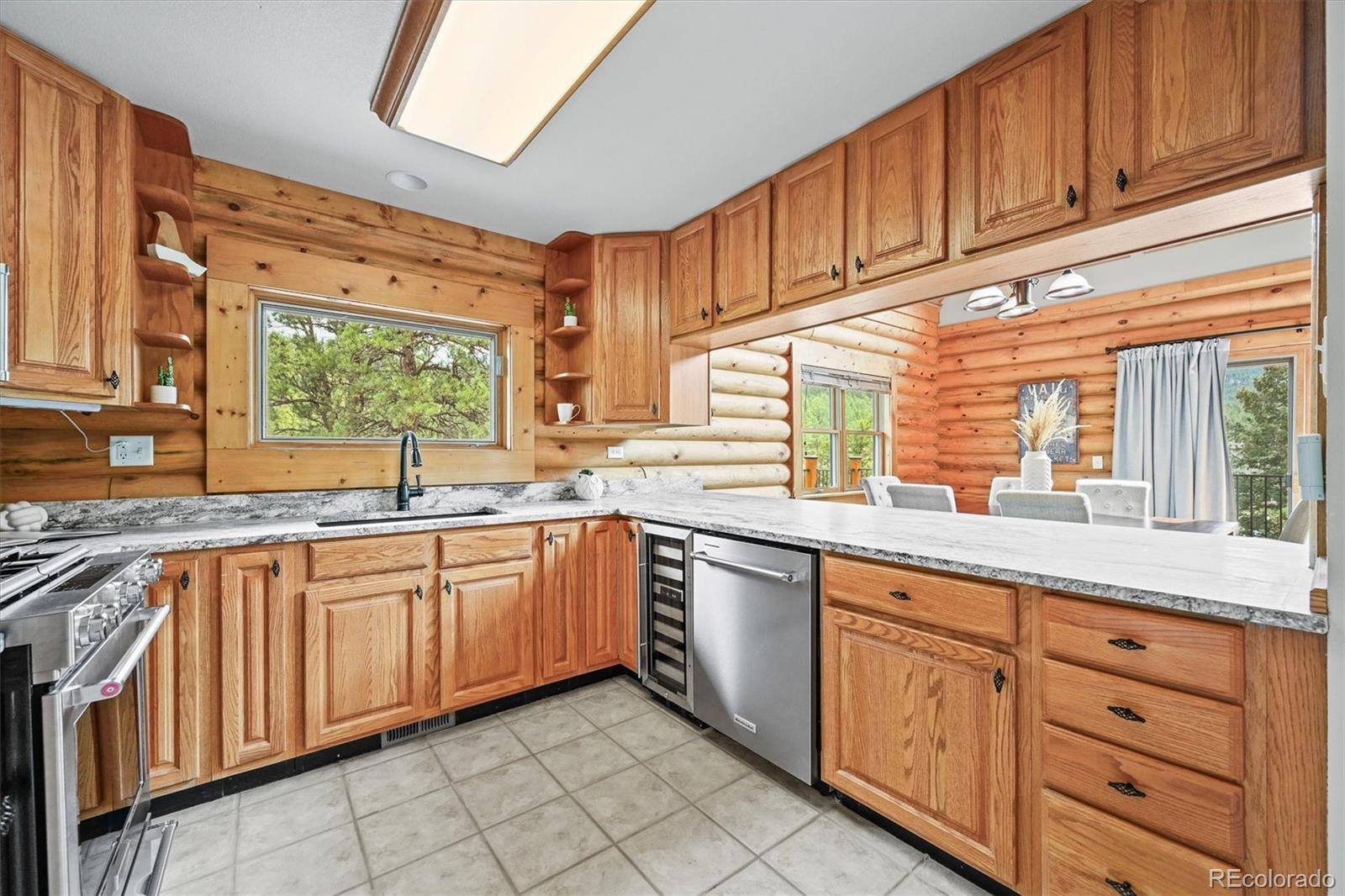 9868 South Overlook Road Sedalia, CO 80135 - Photo 27 of 50 a kitchen with sink cabinets and appliances