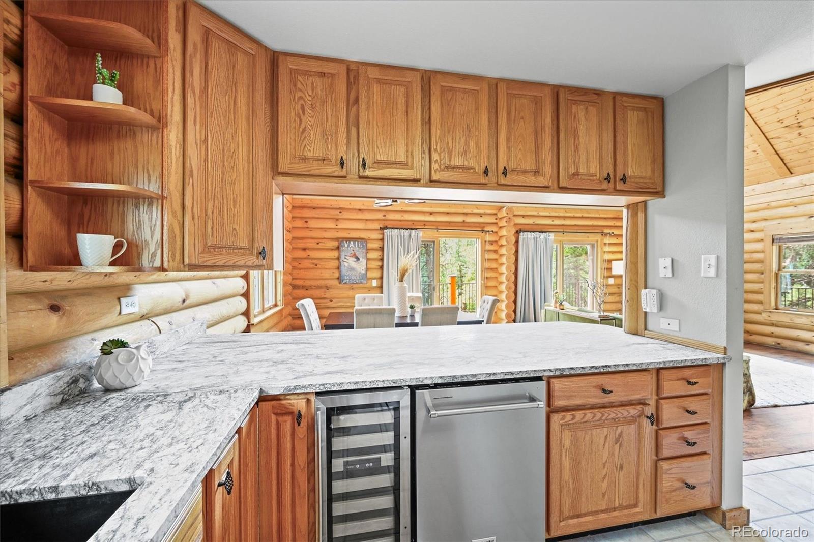 9868 South Overlook Road Sedalia, CO 80135 - Photo 29 of 50 a kitchen with granite countertop white cabinets and sink