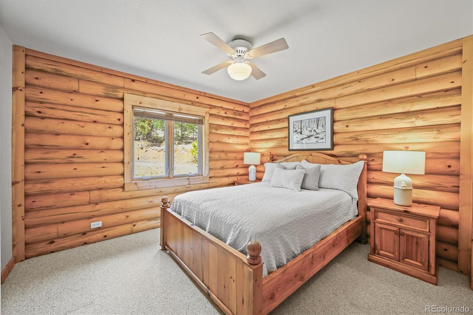9868 South Overlook Road Sedalia, CO 80135 - Photo 31 of 50 a bed room with a bed and window