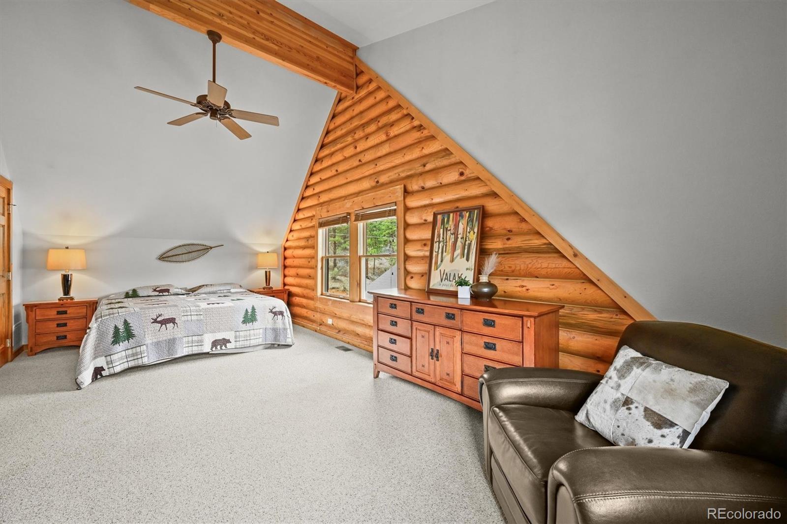9868 South Overlook Road Sedalia, CO 80135 - Photo 35 of 50 a view of a bedroom with furniture and a window