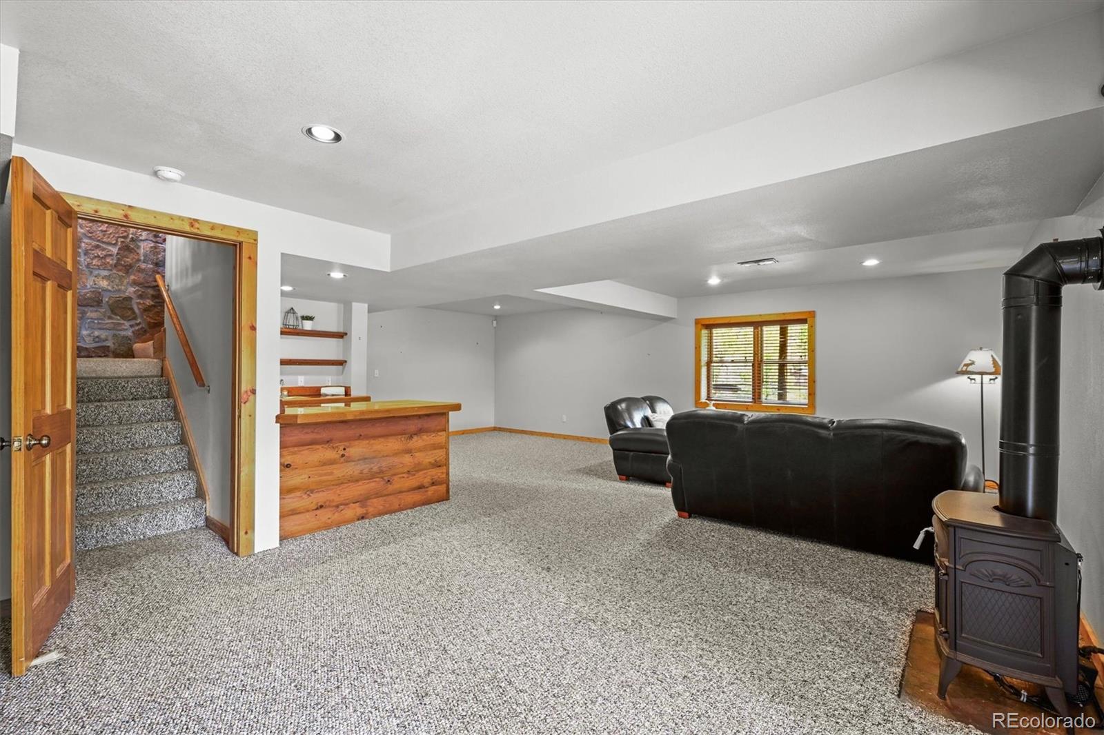 9868 South Overlook Road Sedalia, CO 80135 - Photo 41 of 50 a living room with furniture and a flat screen tv