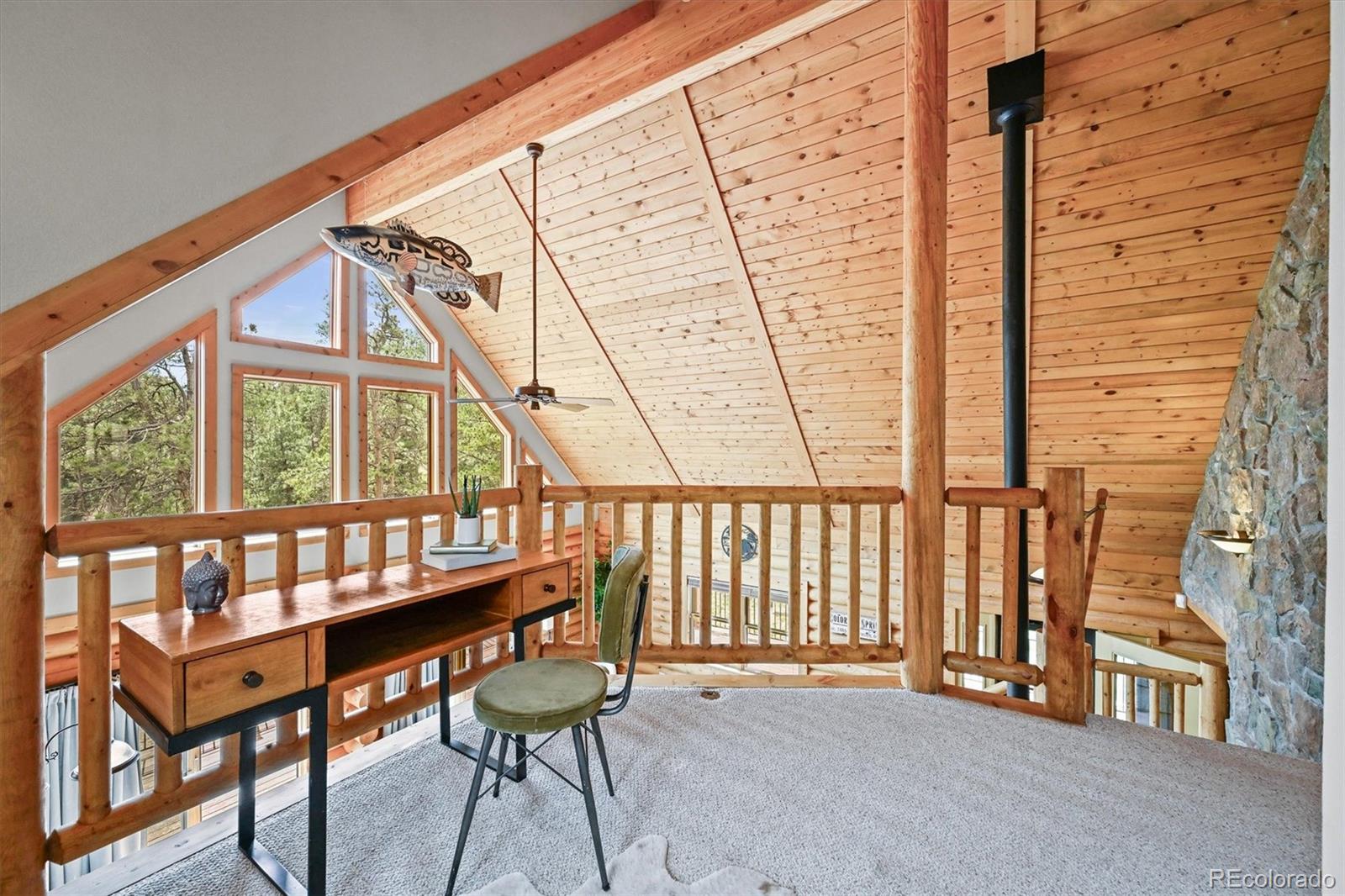 9868 South Overlook Road Sedalia, CO 80135 - Photo 42 of 50 a view of a porch with furniture and a window
