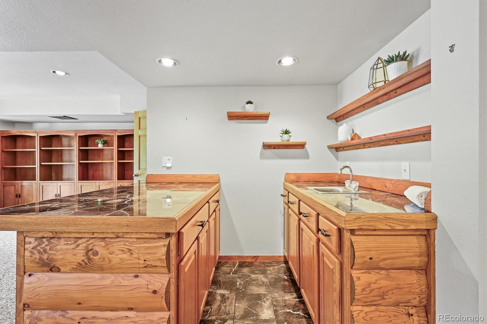 9868 South Overlook Road Sedalia, CO 80135 - Photo 45 of 50 a bathroom with a sink toilet and shower