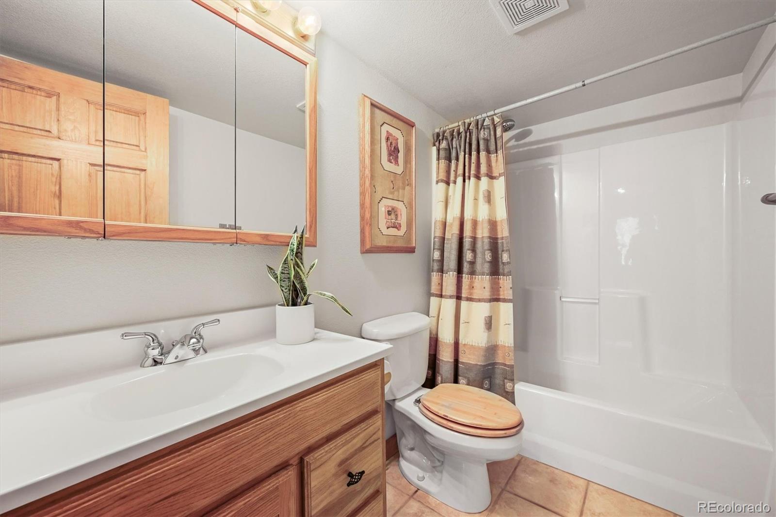 9868 South Overlook Road Sedalia, CO 80135 - Photo 50 of 50 a bathroom with a sink toilet and shower