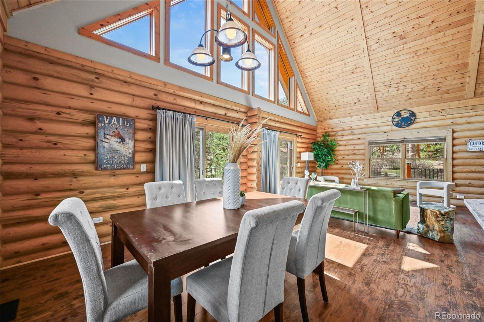 9868 South Overlook Road Sedalia, CO 80135 - Photo 5 of 50 a dining room with furniture and a floor to ceiling window