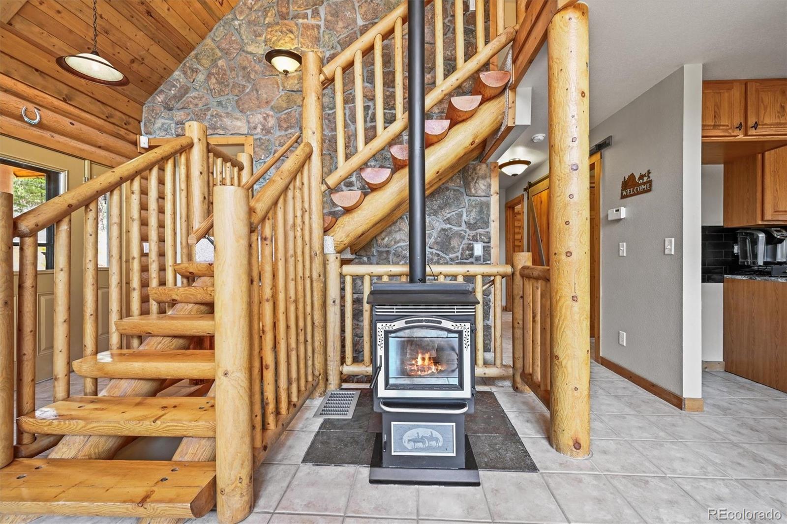 9868 South Overlook Road Sedalia, CO 80135 - Photo 9 of 50 a view of an entryway with wooden floor