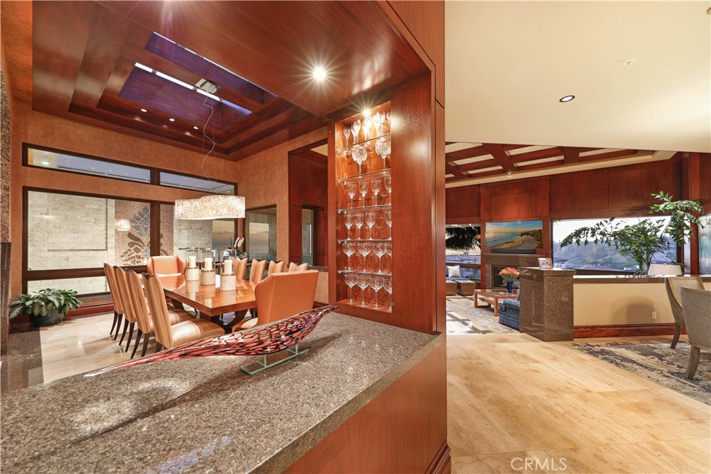 51 Ritz Cove Drive Dana Point, CA 92629 - Photo 26 of 51 a view of a patio with table and chairs a barbeque with potted plants