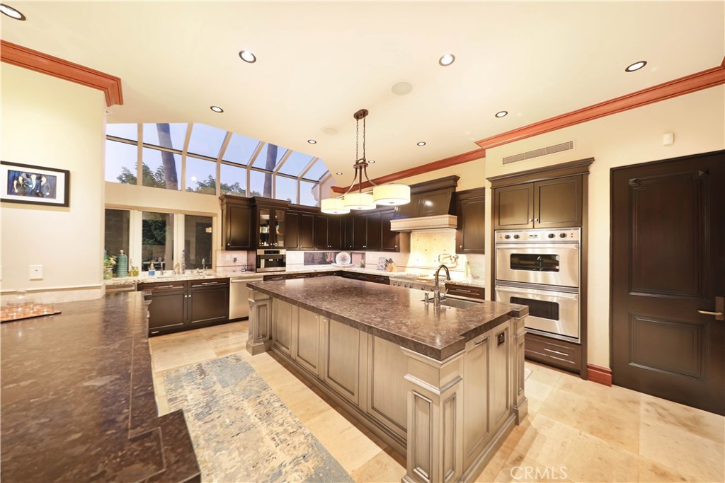 51 Ritz Cove Drive Dana Point, CA 92629 - Photo 28 of 51 a kitchen with stainless steel appliances granite countertop a sink and a refrigerator