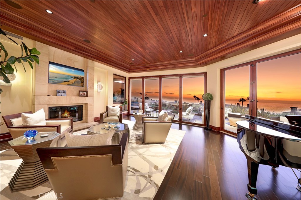 51 Ritz Cove Drive Dana Point, CA 92629 - Photo 29 of 51 a living room with furniture fireplace and floor to ceiling window
