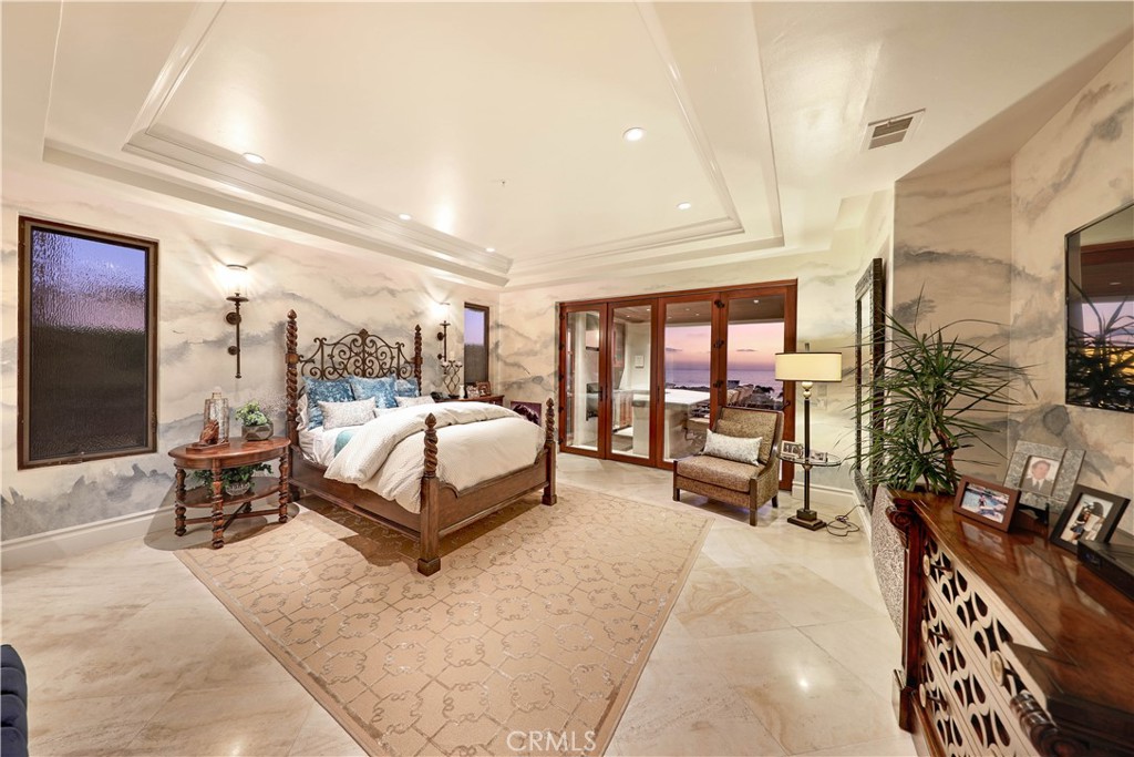 51 Ritz Cove Drive Dana Point, CA 92629 - Photo 30 of 51 a bedroom with a bed and large windows