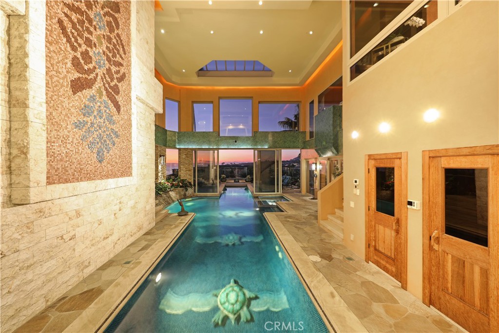 51 Ritz Cove Drive Dana Point, CA 92629 - Photo 33 of 51 a large swimming pool with large windows and table