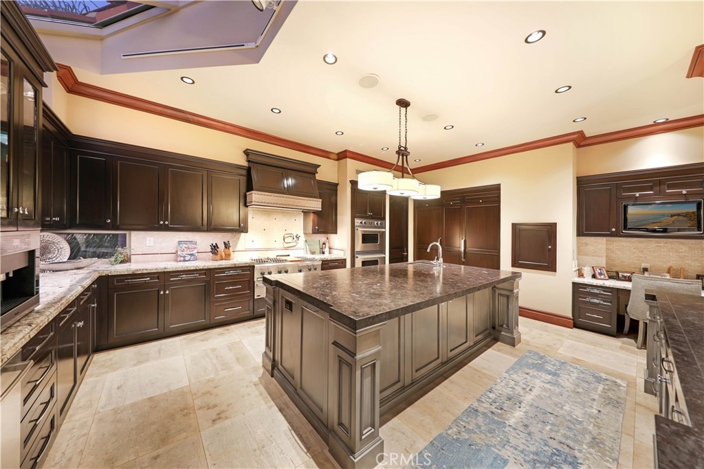 51 Ritz Cove Drive Dana Point, CA 92629 - Photo 7 of 51 a kitchen with stainless steel appliances granite countertop a sink and a refrigerator
