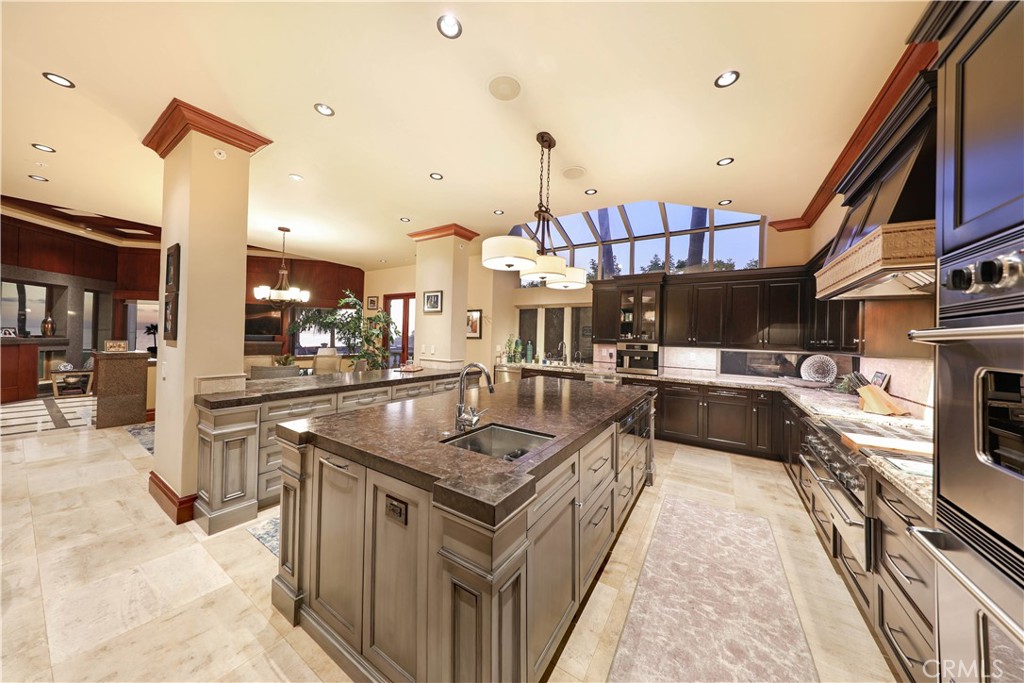 51 Ritz Cove Drive Dana Point, CA 92629 - Photo 8 of 51 a kitchen with stainless steel appliances granite countertop a sink a stove and a wooden floors