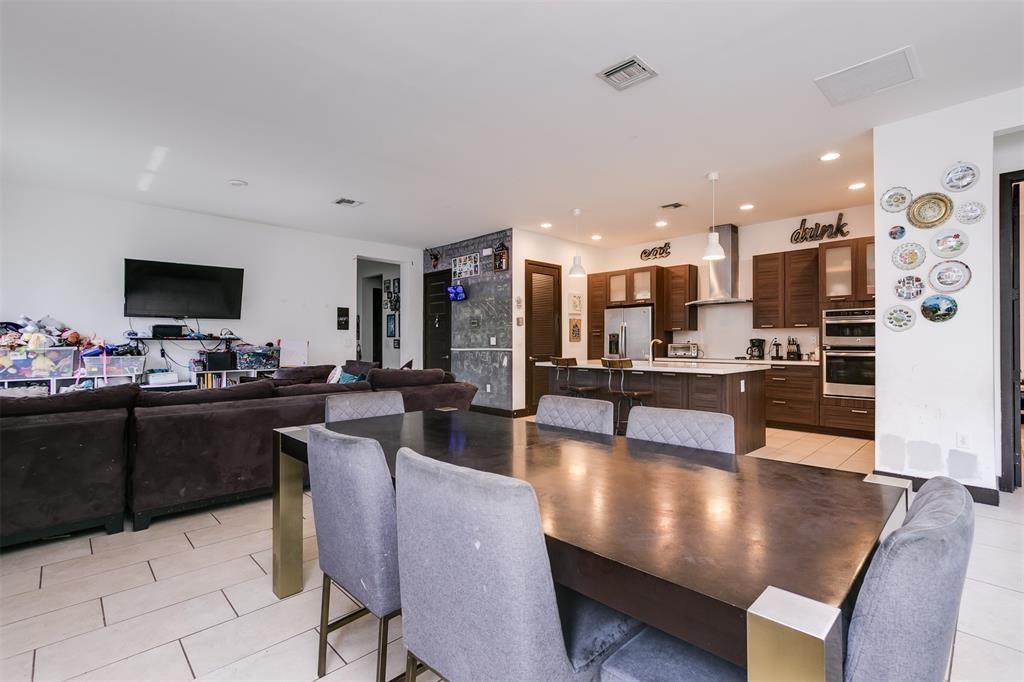 15901 Southwest 136 Way Miami, FL 33196 - Photo 12 of 34 a kitchen with stainless steel appliances kitchen island granite countertop a sink and cabinets