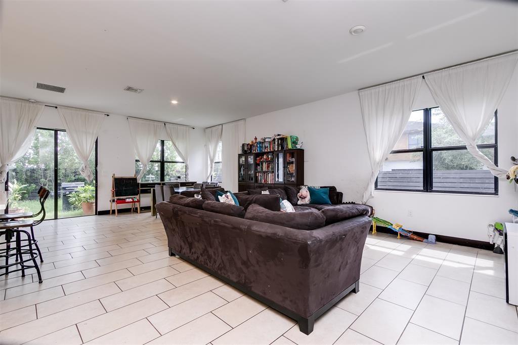 15901 Southwest 136 Way Miami, FL 33196 - Photo 13 of 34 a living room with furniture and a large window