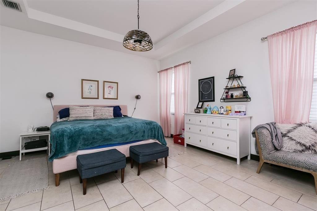 15901 Southwest 136 Way Miami, FL 33196 - Photo 20 of 34 a bedroom with a bed and a window