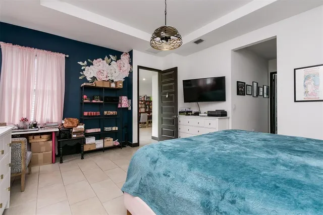 a living room with furniture and flat screen tv