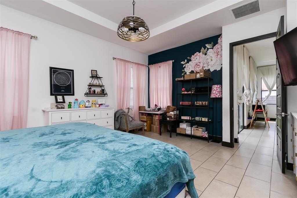 15901 Southwest 136 Way Miami, FL 33196 - Photo 23 of 34 a bedroom with furniture and a flat screen tv