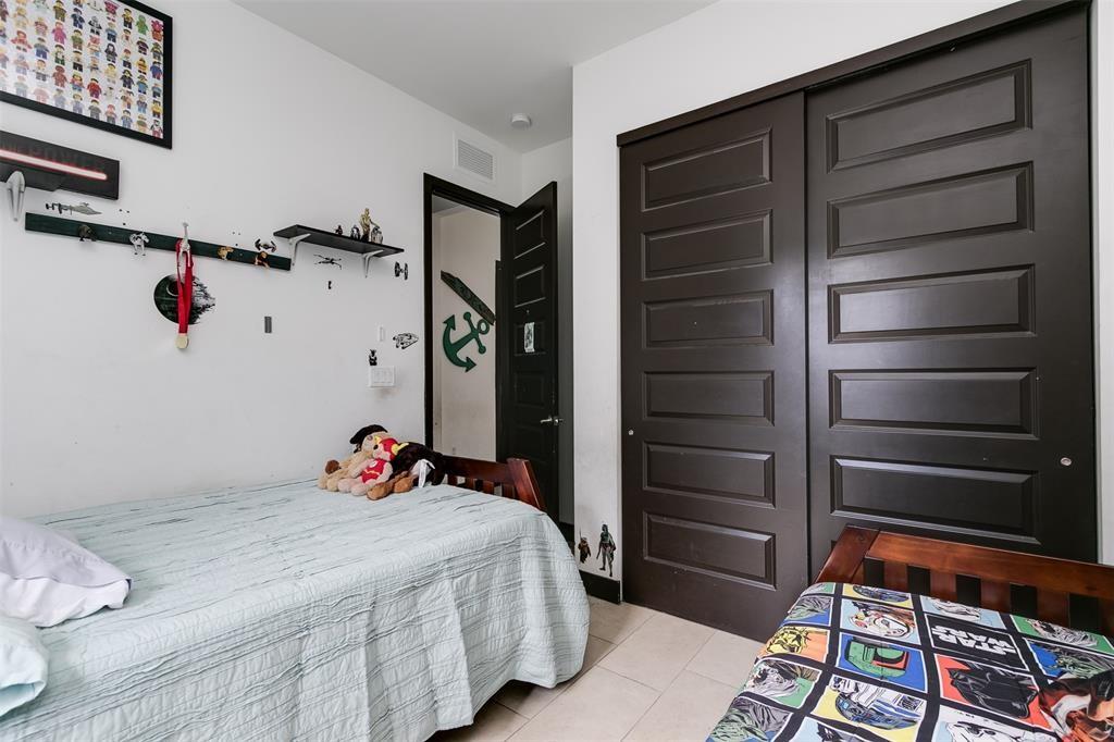 15901 Southwest 136 Way Miami, FL 33196 - Photo 29 of 34 a bed room with a bed and a closet