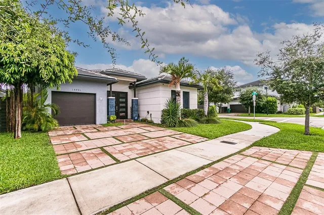 a patio with a yard and plants
