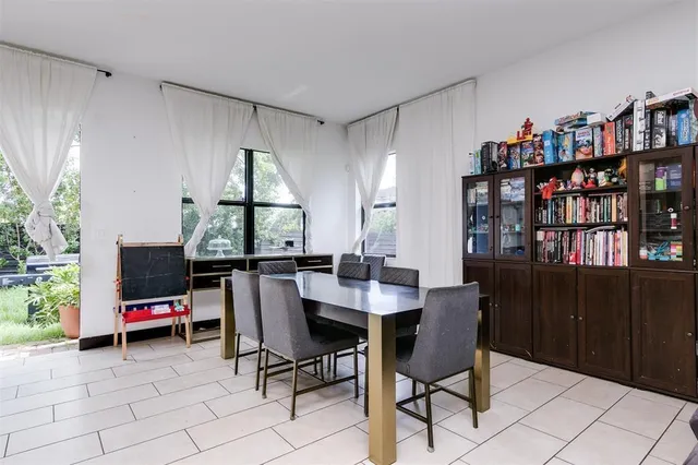 a view of a workspace with furniture and a potted plant