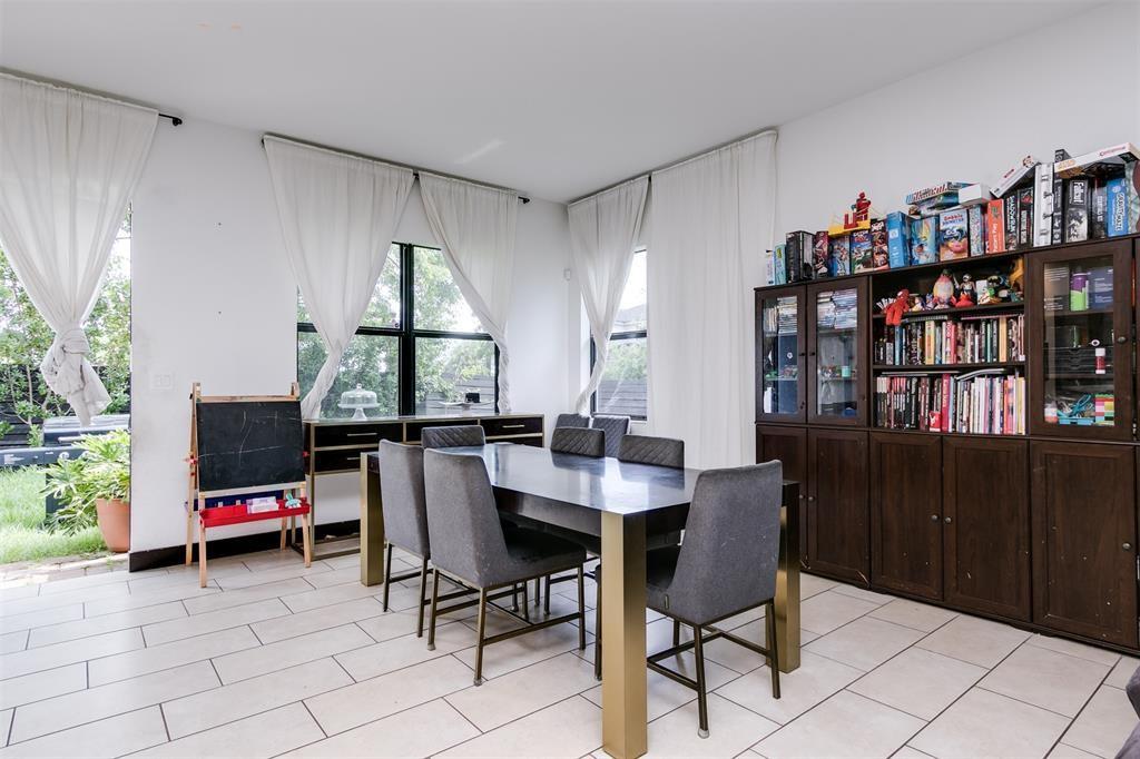 15901 Southwest 136 Way Miami, FL 33196 - Photo 10 of 34 a view of a workspace with furniture and a potted plant