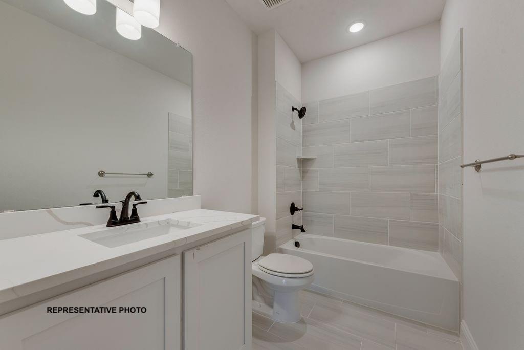 509 Clifton Court Springtown, TX 76082 - Photo 18 of 21 a bathroom with a sink a toilet and shower