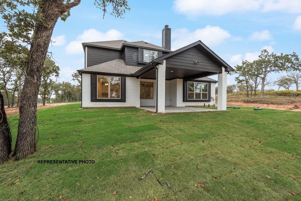 509 Clifton Court Springtown, TX 76082 - Photo 19 of 21 front view of a house with a yard