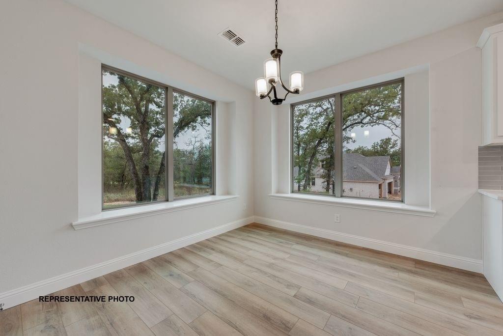 509 Clifton Court Springtown, TX 76082 - Photo 7 of 21 a view of an empty room with a window