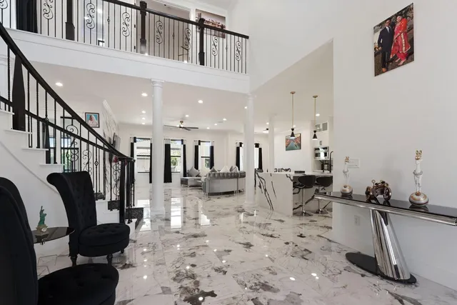 a living room with furniture fireplace and flat screen tv