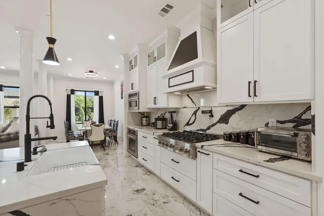 a bathroom with a toilet a sink and a mirror