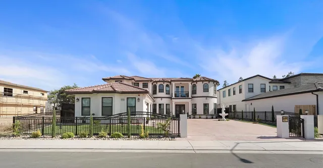 a front view of a house with yard